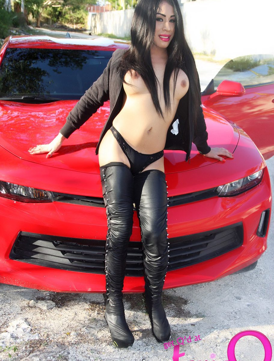 Shemale Video Blog - Shemale in FUCK ME BOOTS posing with her Red Sports Car â€“ Tranny Porn Blog